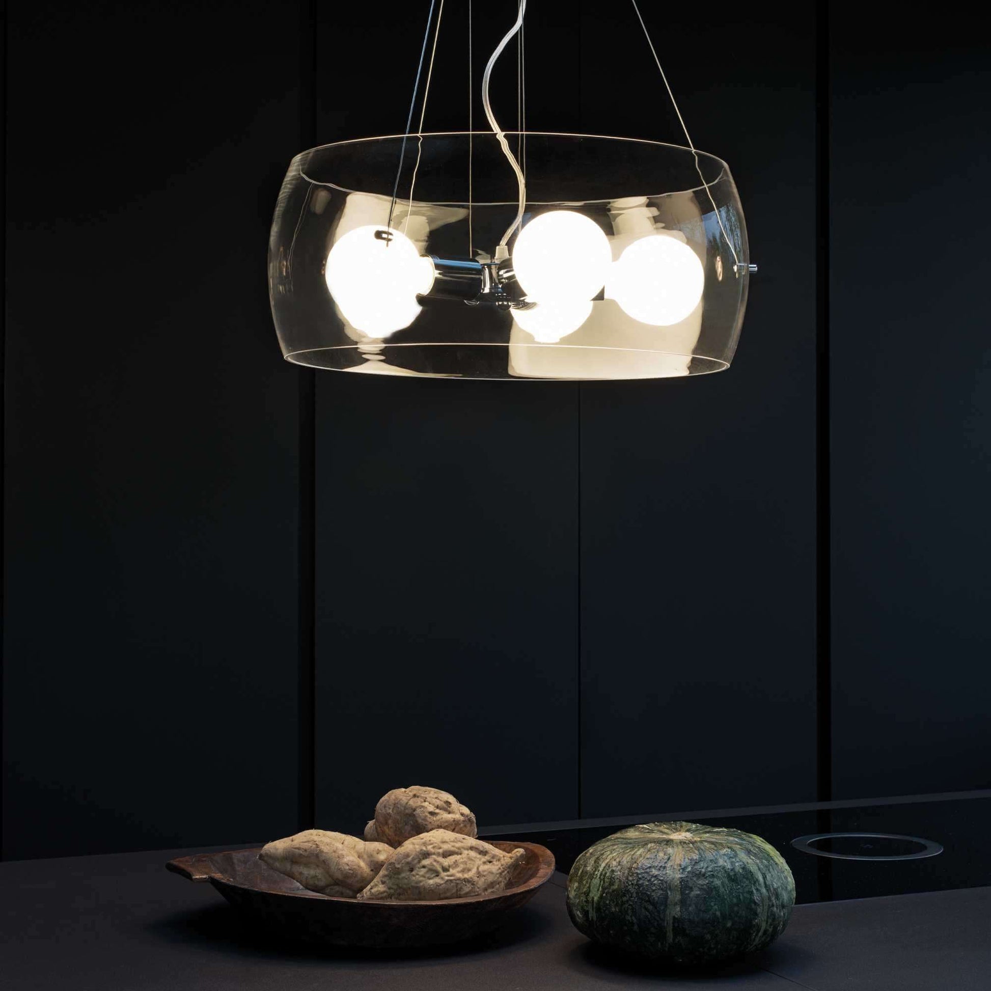 Ideal Lux AUDI-10 pendant light with transparent glass in modern kitchen setting, featuring dimmable lighting and chrome metal frame.