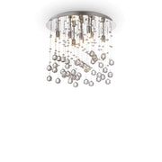 Ideallux MOONLIGHT ceiling light with 8 bulbs in silver, featuring a metal frame, hanging crystals, and a 40cm diameter.