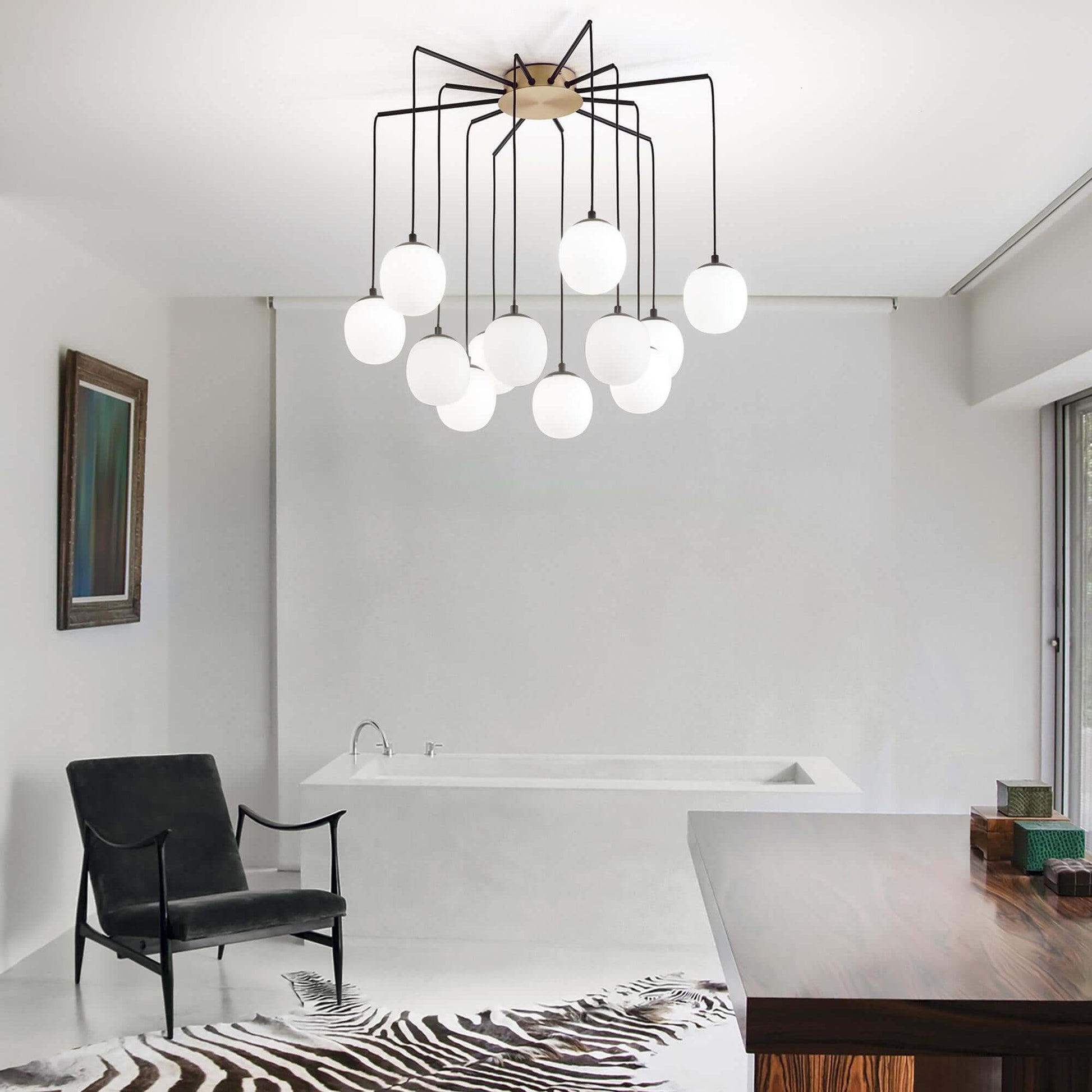 Elegant Ideal Lux RHAPSODY 12-bulb hanging light fixture in a modern room with a zebra rug and contemporary decor.