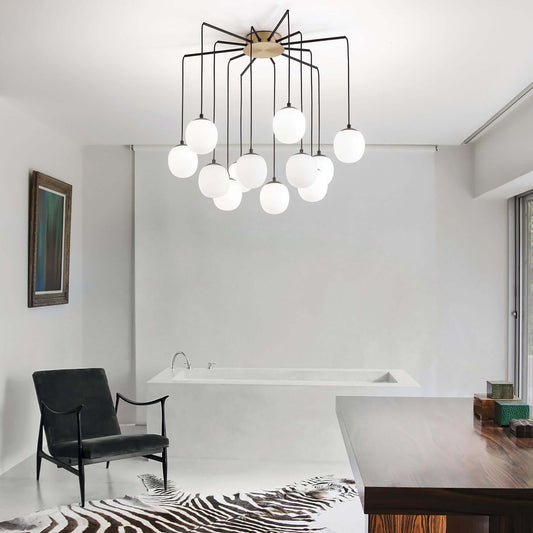 Elegant Ideal Lux RHAPSODY 12-bulb hanging light fixture in a modern room with a zebra rug and contemporary decor.