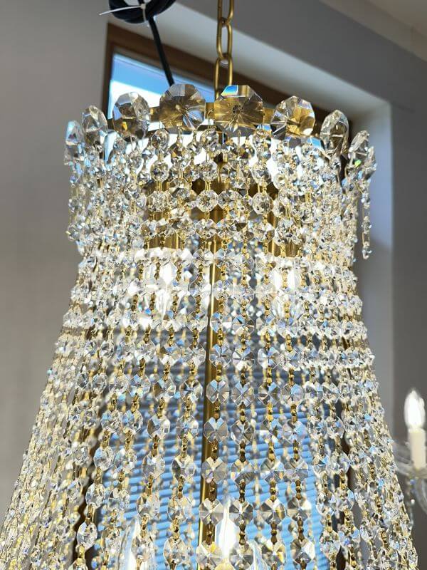 Elegant crystal chandelier with gold accents, featuring intricate glass and crystal design, suitable for staircases, 90cm diameter.