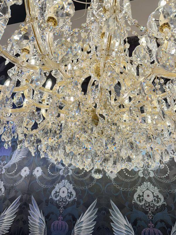 Luxurious gold Maria Theresia chandelier with crystal glass arms, intricate design, Ø120cm, enhances elegant interior decor.