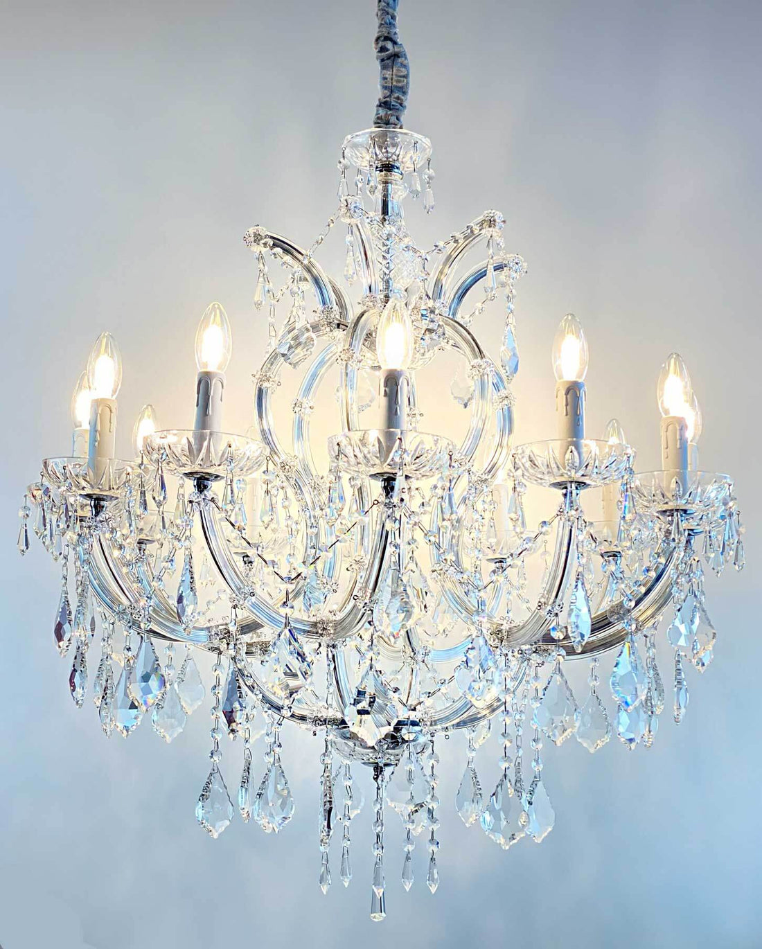 Luxurious Kristall Kronleuchter Mozart chandelier with 12 lights and crystal glass arms, ideal for elegant interior decoration.