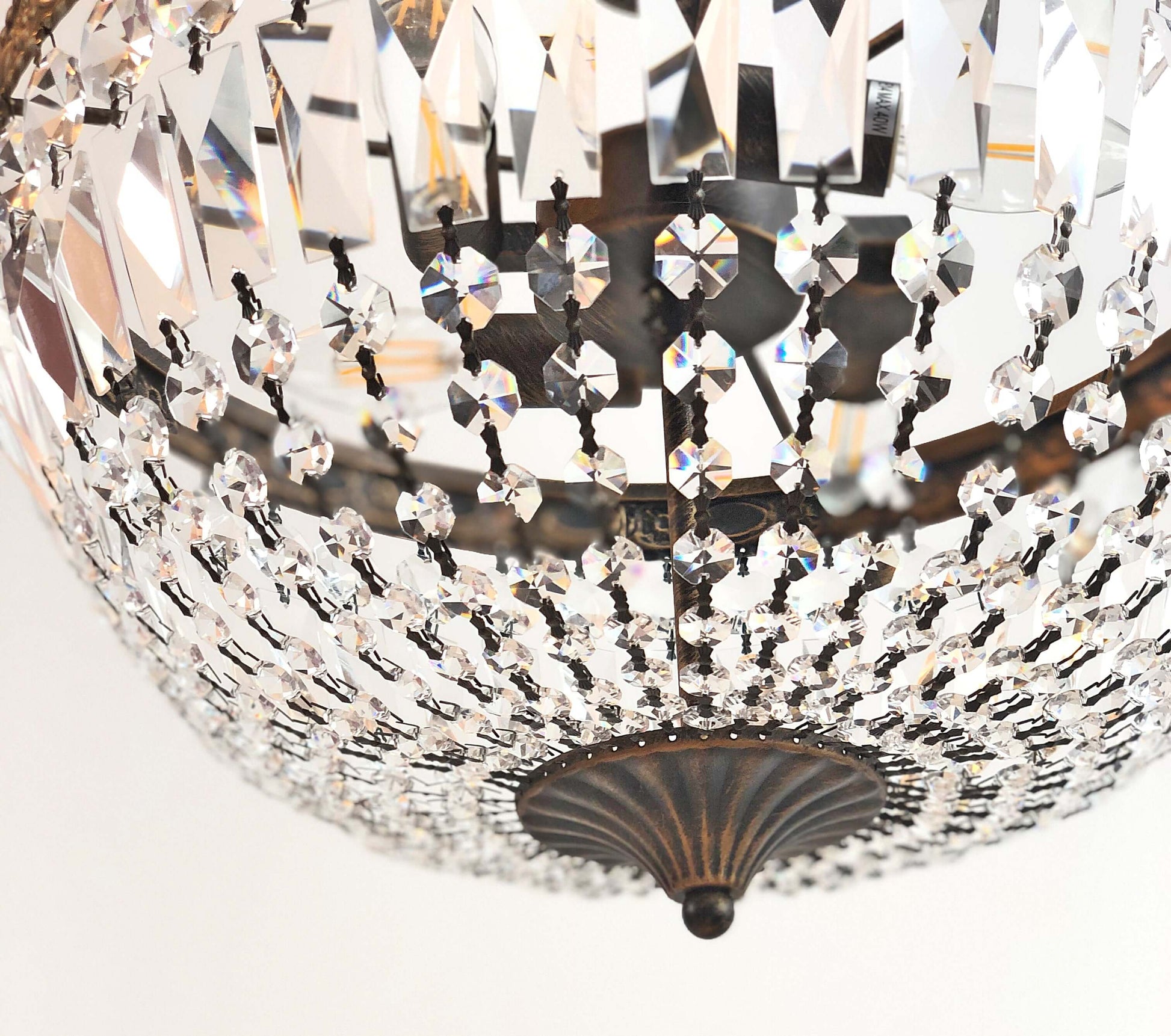 Close-up of ornate Kristall Deckenlampe Florence Ø40cm with antique gold finish and sparkling cut crystals, ideal for elegant spaces.