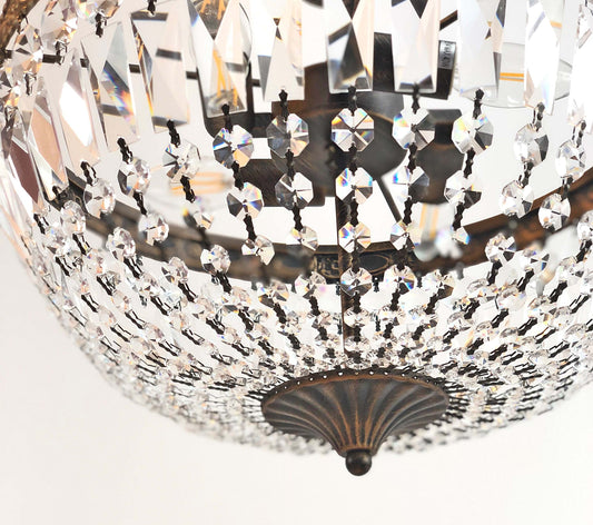 Close-up of ornate Kristall Deckenlampe Florence Ø40cm with antique gold finish and sparkling cut crystals, ideal for elegant spaces.