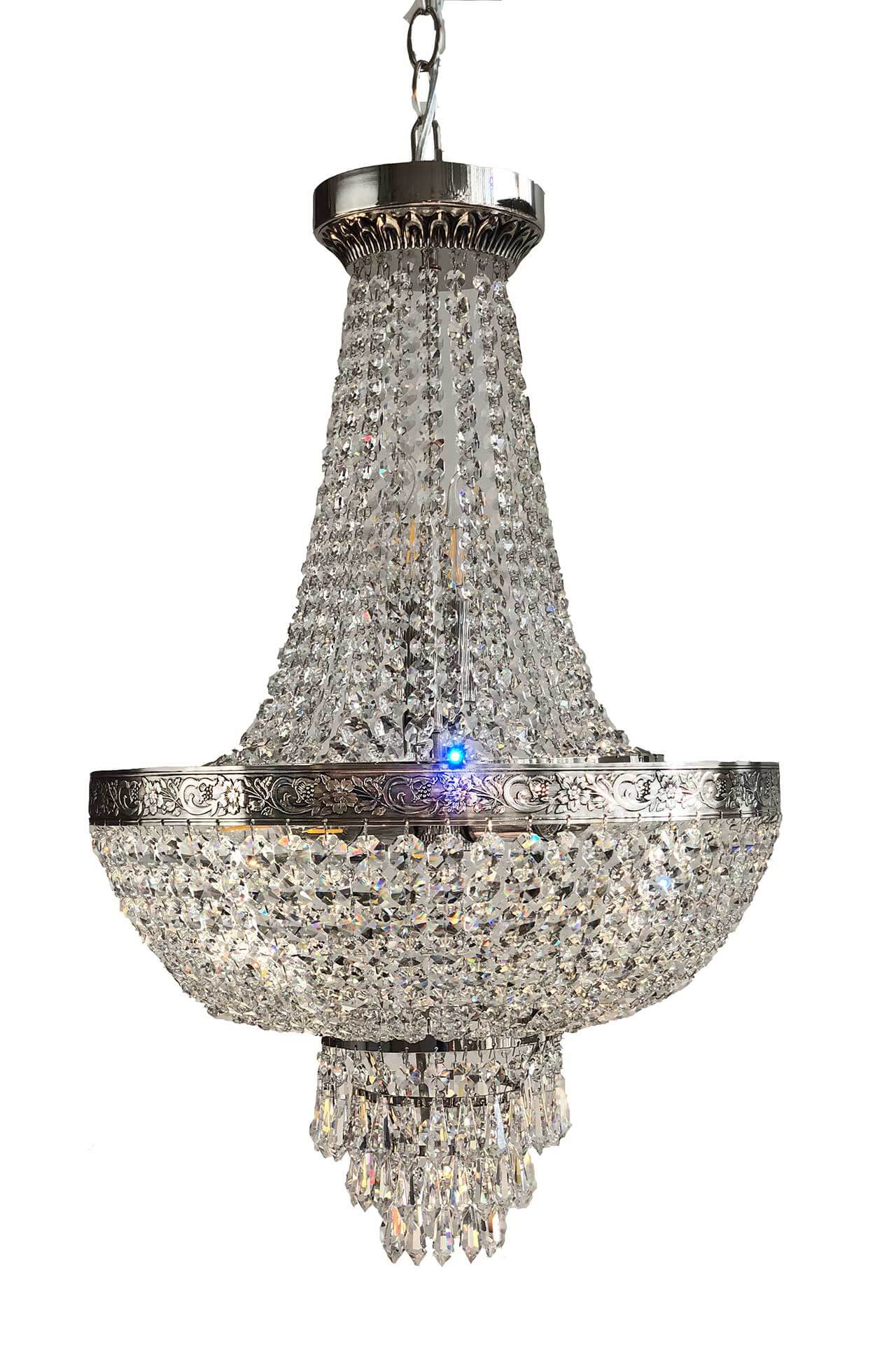 Elegant silver chandelier with cut crystals, hanging from ceiling, offering dimmable lighting and luxurious sparkle in any room.