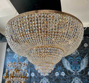 Luxurious gold crystal chandelier with Ø80cm diameter, features shimmering crystals, perfect for adding elegance to any room.