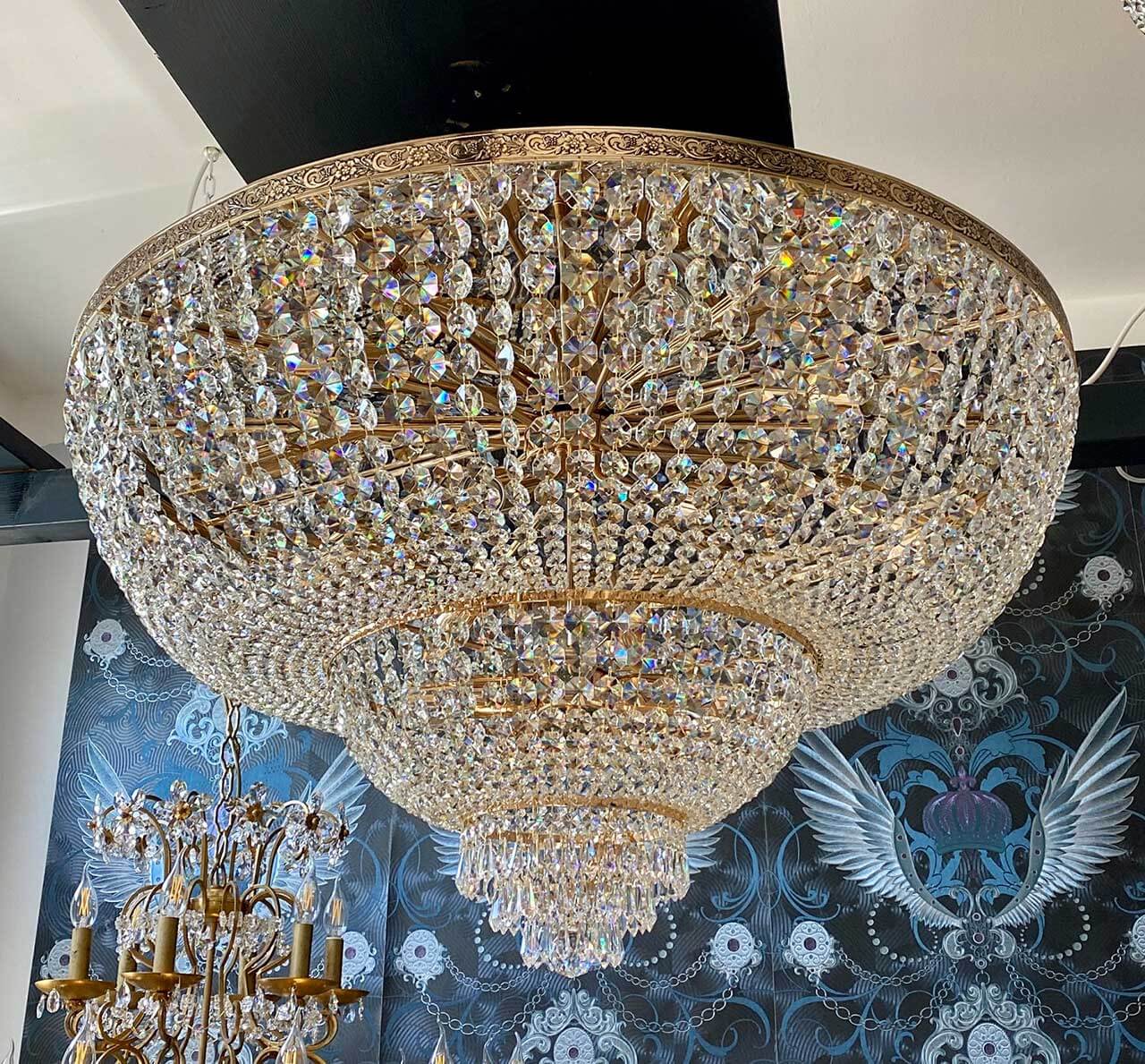 Luxurious gold crystal chandelier with Ø80cm diameter, features shimmering crystals, perfect for adding elegance to any room.