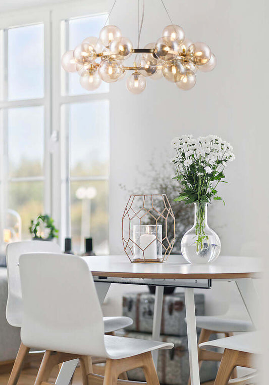 Modern dining room with Maytoni Dallas glass and metal pendant light above table.