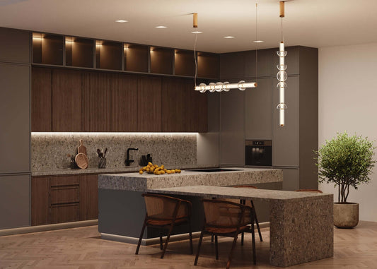 Modern kitchen featuring a sleek Maytoni COSMO pendant light with metal fixtures in black and gold above a stone island.