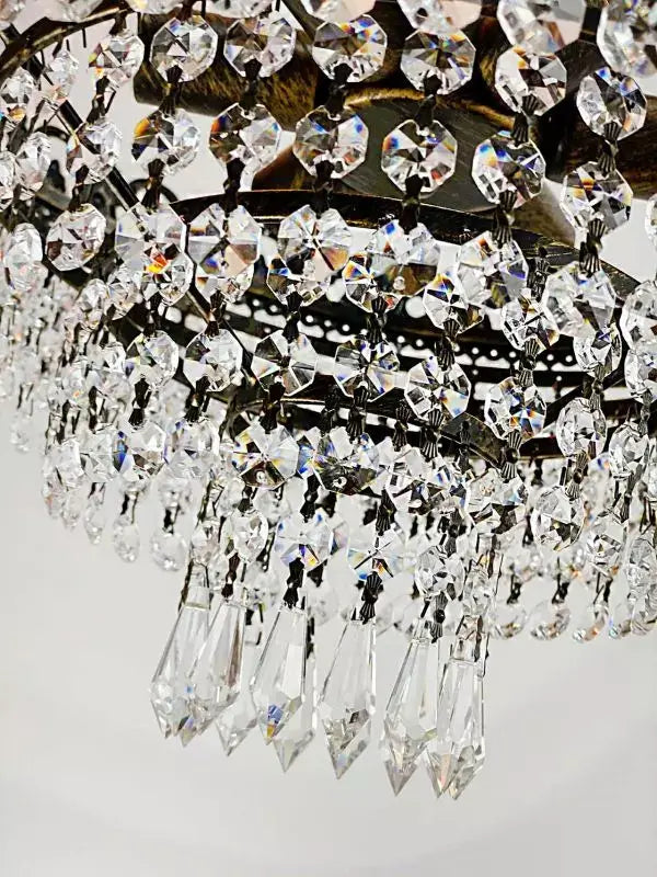 Close-up of KRISTALL DECKENLEUCHTE VIKTORIA with sparkling cut crystals and antique gold and metal finish, Ø42cm chandelier.