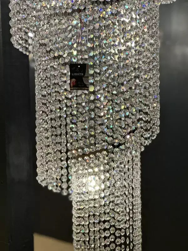 Close-up of PGA-Lights Twister chandelier with sparkling crystals, silver finish, 50cm diameter, perfect for showrooms.