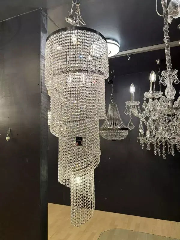 Twister spiral chandelier with sparkling crystals, 50cm diameter, 145cm height, silver chrome finish in showroom setting.
