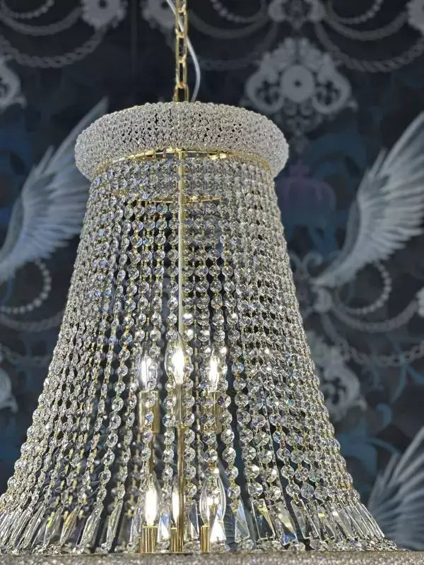 Gold-colored crystal chandelier with shimmering crystals, 80cm diameter, dimmable, showcasing a luxurious and elegant design.