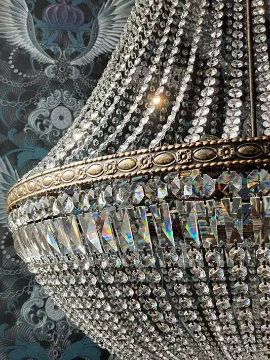 Close-up of the Florence Antique Crystal Chandelier Ø100cm with dazzling cut crystals and metal rim, perfect for elegant interiors.