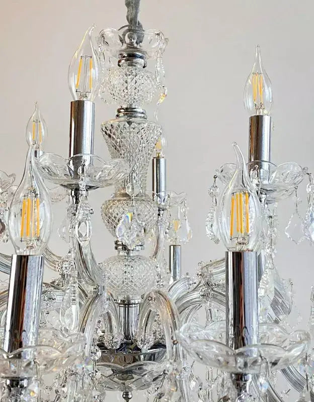 Detail view of the Kristall Kronleuchter with 18 lights, featuring sparkling lead crystal and glass arms.