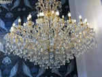 Luxurious gold chandelier with crystal arms, 42 lights, and intricate design, ideal for elegant interiors; Maria Theresia style, Ø150cm.