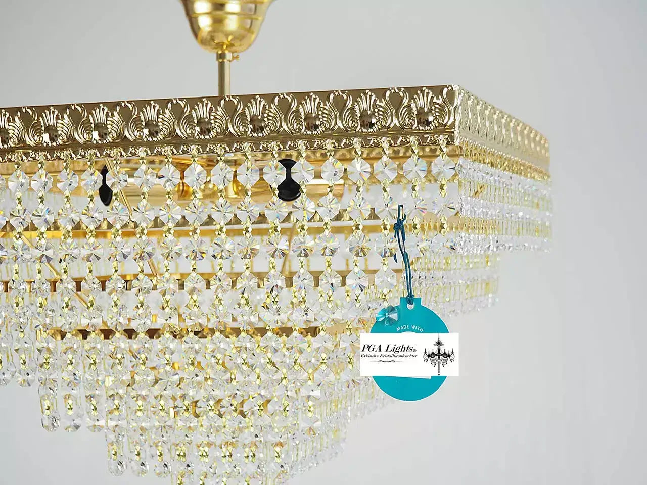 Elegant gold crystal chandelier with shimmering lead crystals, antique design, 45cm diameter, perfect room centerpiece.
