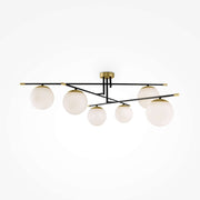 Maytoni Deckenleuchte Nostalgia with matte gold metal and frosted glass globes, featuring a trendy asymmetric design and dimmable lighting.